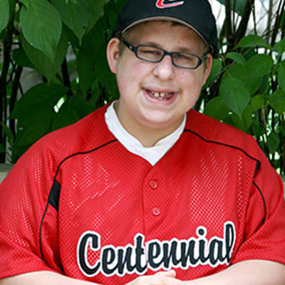 Boy with LS in baseball uniform