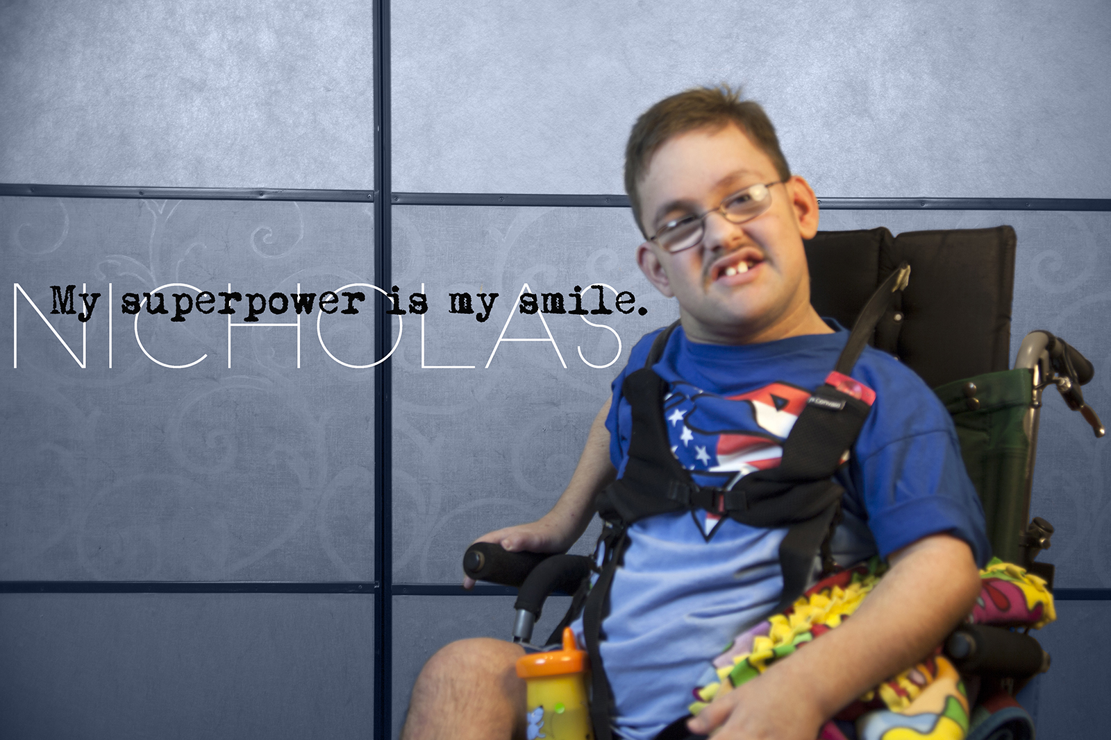 Young man in wheelchair smiling