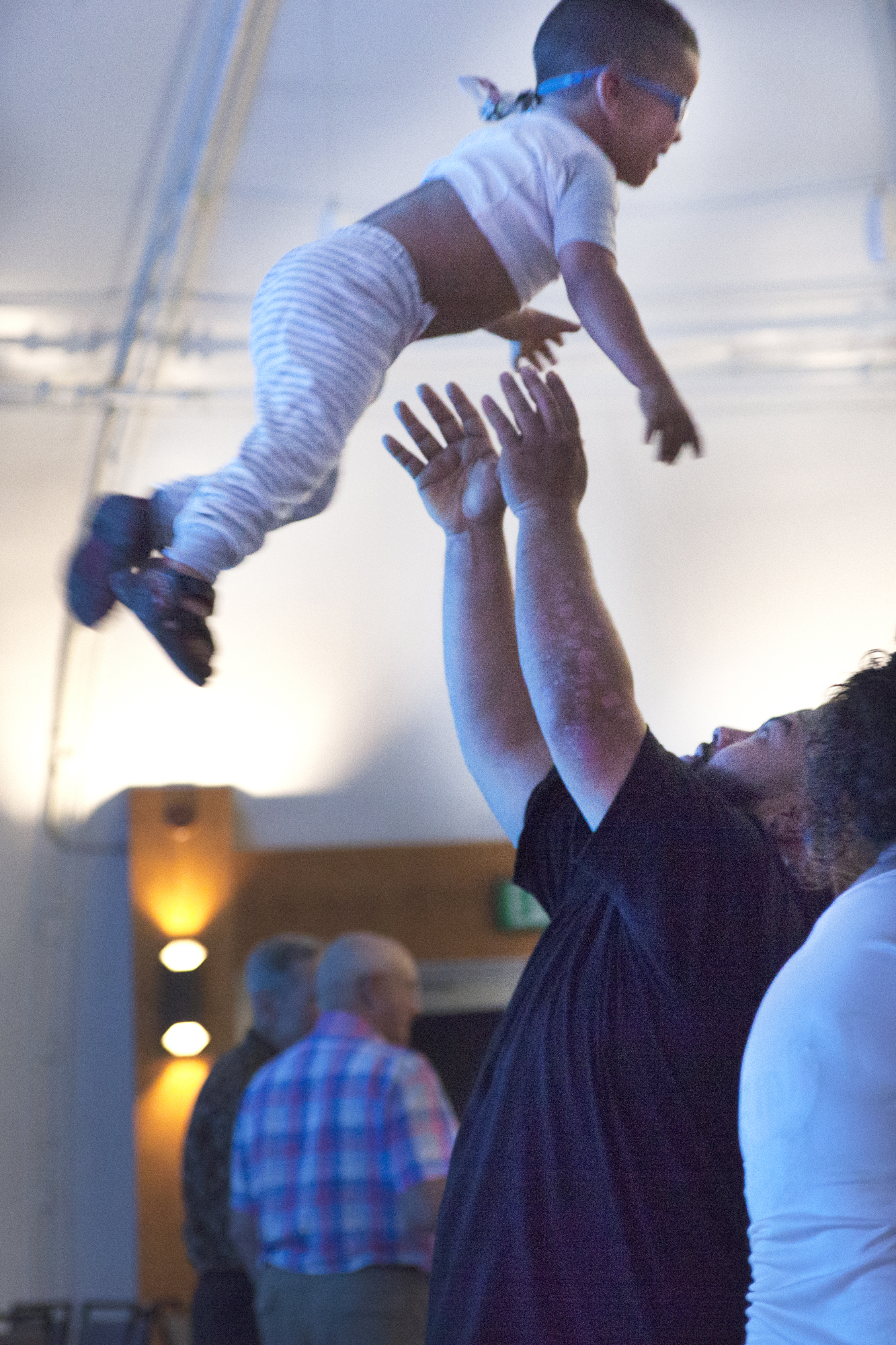 Dad tossing boy in the air