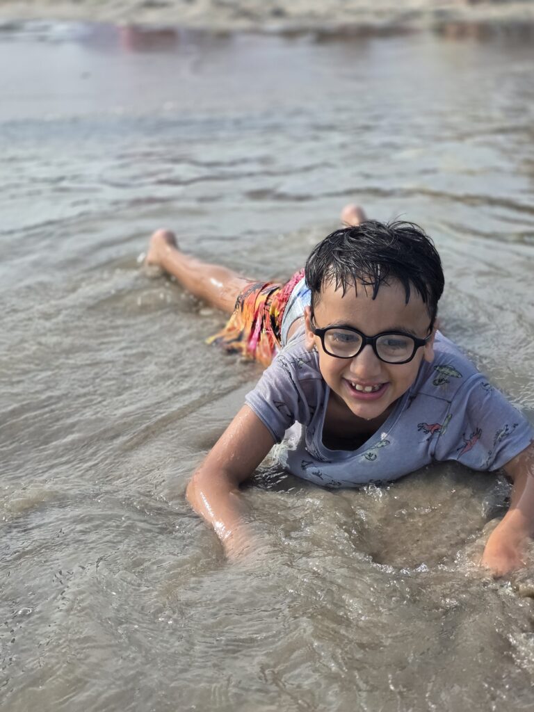 lowe syndrome boy enjoying beach